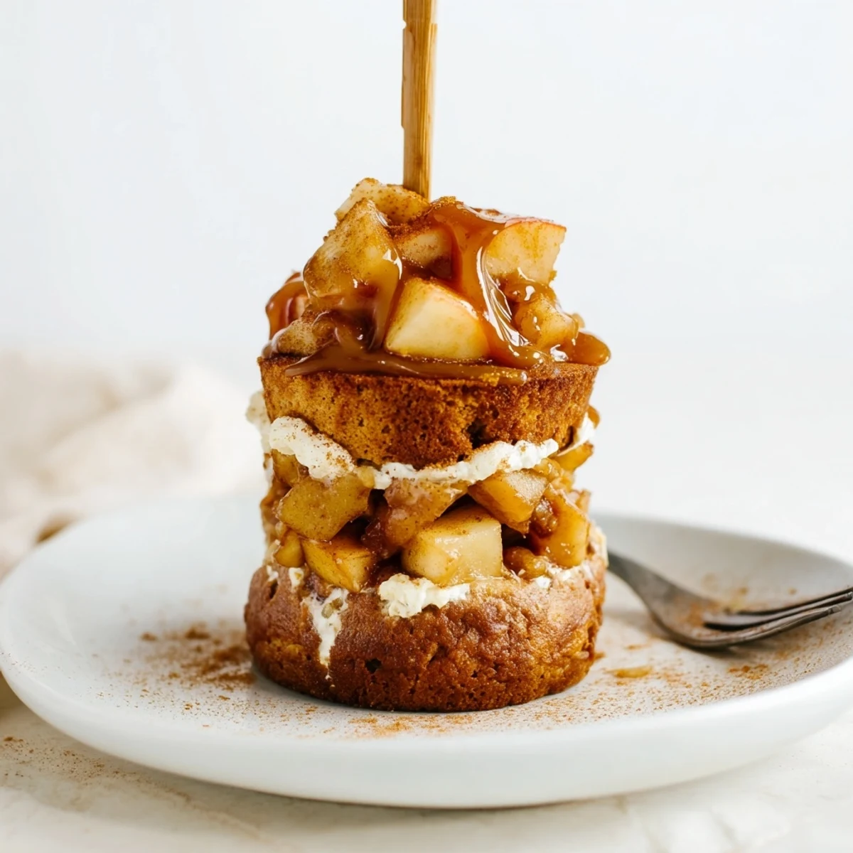 Decadent Caramel Apple Chai Cheesecake Cake Muffin Skewers drizzled with rich caramel sauce.  