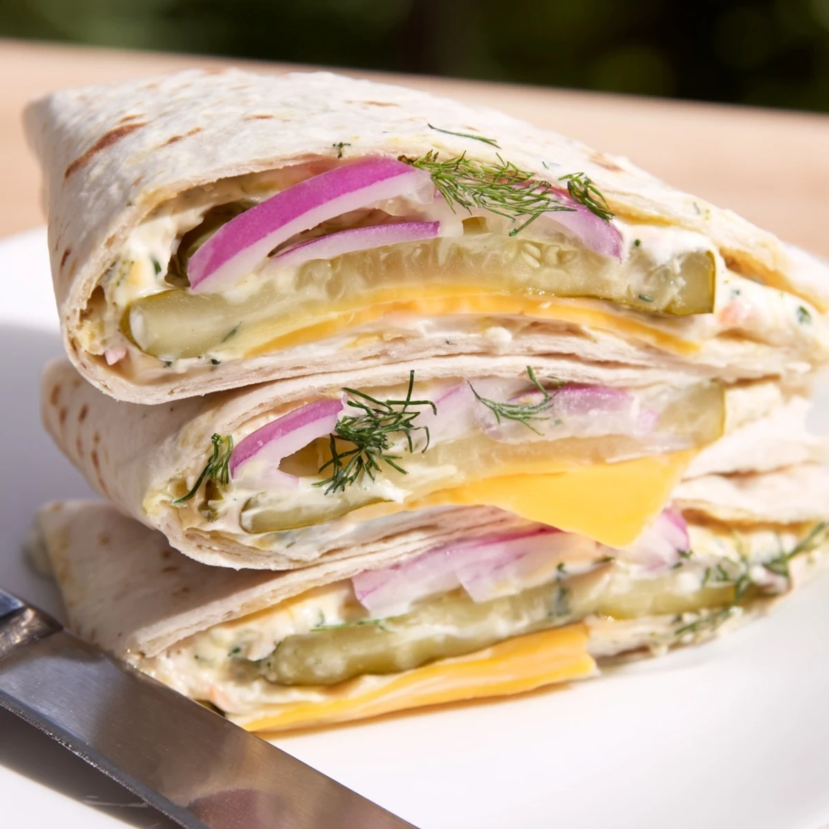 Deliciously stuffed Pickle-in-a-Blanket snack, ideal for picnics and gatherings.