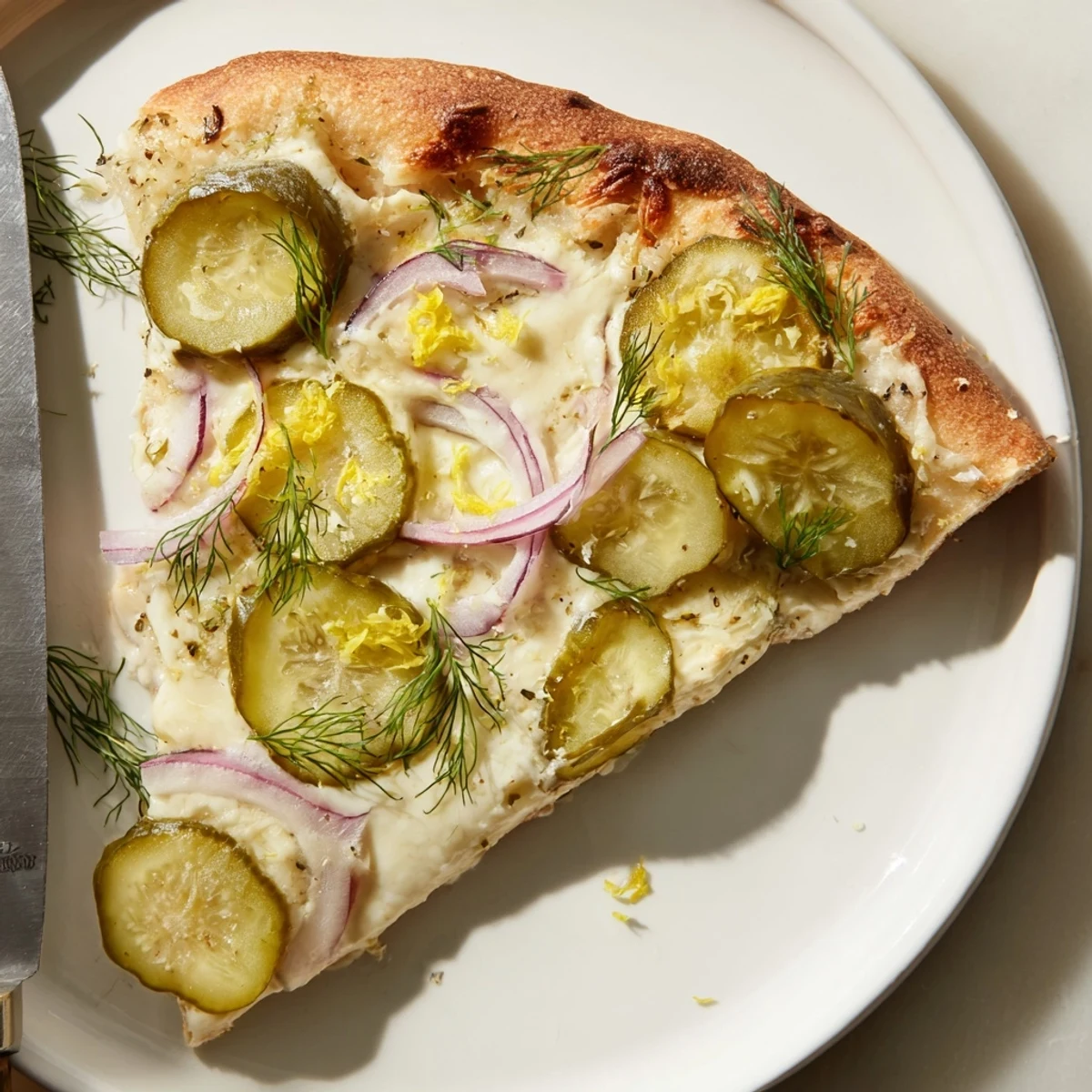 Creamy Pickle Pizza topped with mozzarella and crunchy dill pickles, freshly baked.  