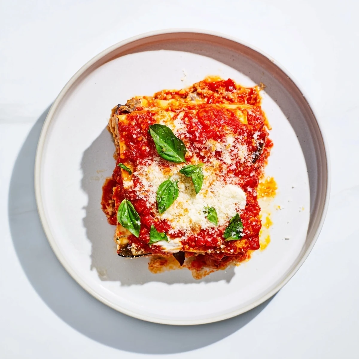 Savory Eggplant Parmesan Lasagna layered with ricotta, mozzarella, and tangy marinara sauce.  