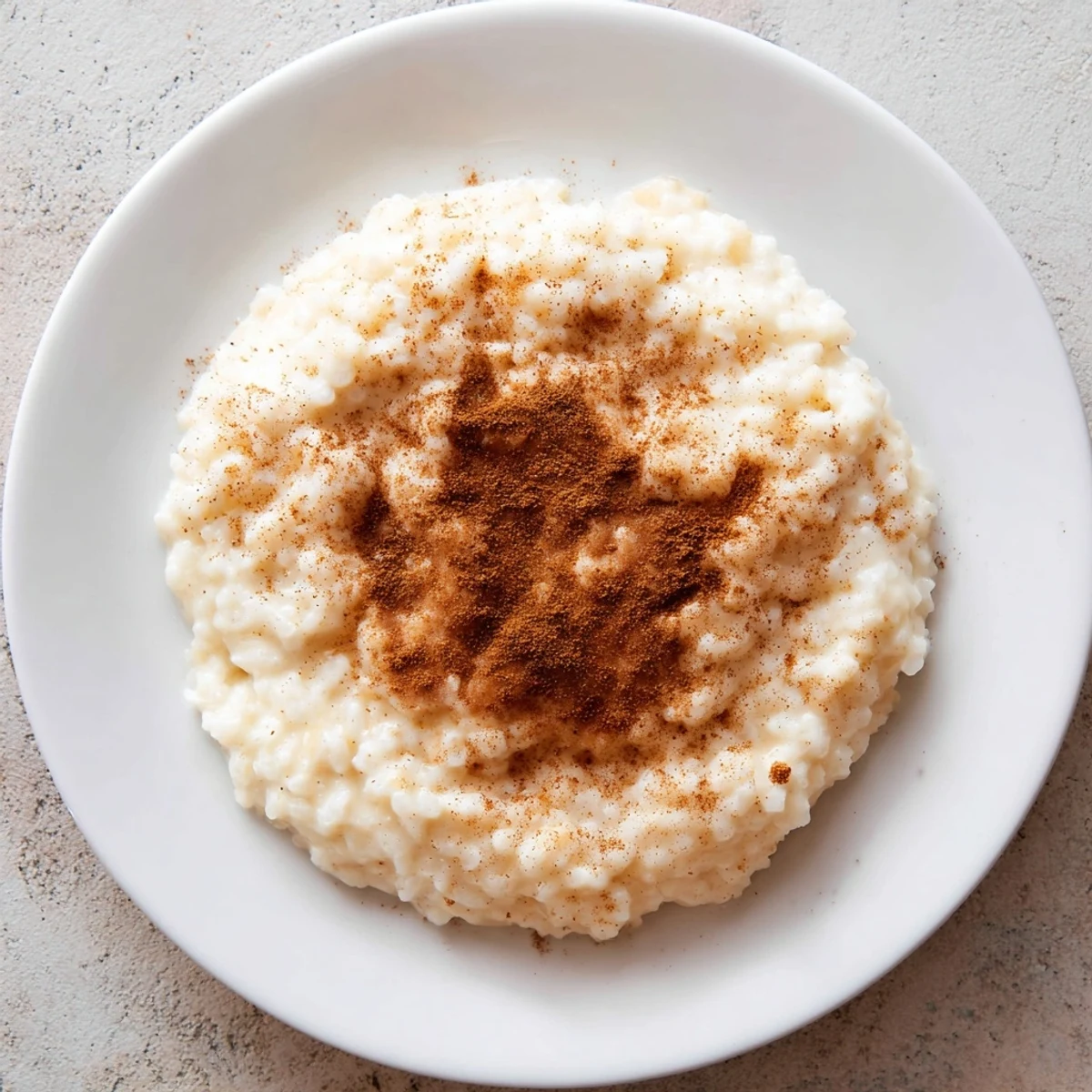 Tempting spoonful of flavorful Rice Pudding with Leftover Rice, perfectly sweet and ready to savor.