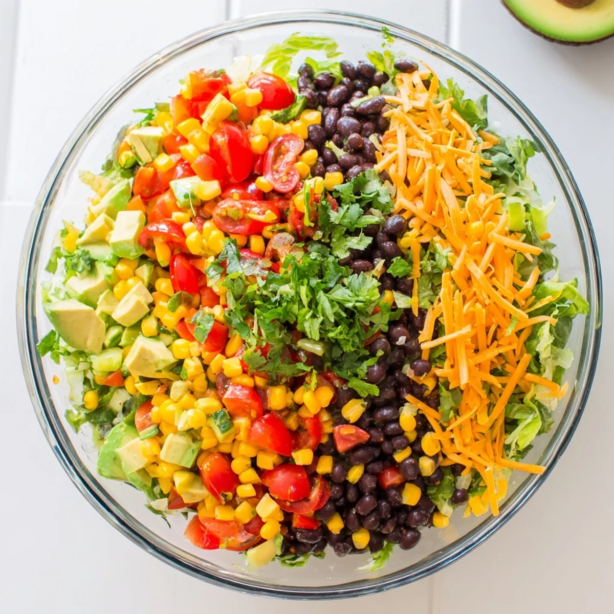 Enjoy this easy Southwest Sunset Palette salad, a stunning vegetarian main dish with fresh cilantro garnish and dressing.