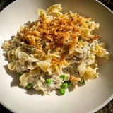 Classic Tuna Noodle Casserole with crispy fried onion topping, creamy texture, and savory flavors delight.