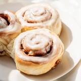 A close-up of Pillow Soft Cinnamon Rolls reveals their fluffy texture and enticing cinnamon sugar filling.