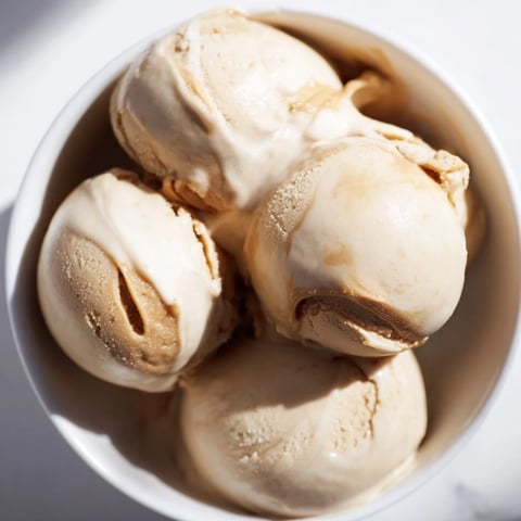 Creamy peanut butter banana ice cream swirls, a healthy vegan dessert blended until smooth.