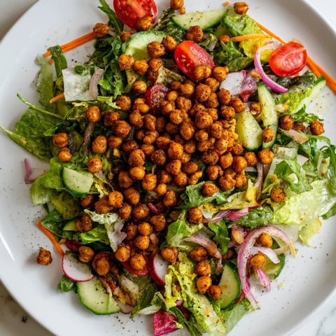 Fresh Mixed Greens Salad with Crispy Chickpea Croutons, a colorful and crunchy vegan delight.