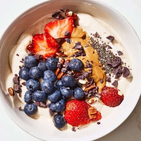 Creamy Protein Ice Cream Bowl with fresh berries, a healthy and delicious homemade treat.