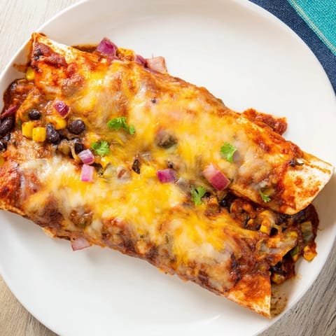 Homemade Farmers Market Vegetarian Enchiladas, baked with melted Monterey Jack, ready to serve with fresh cilantro.
