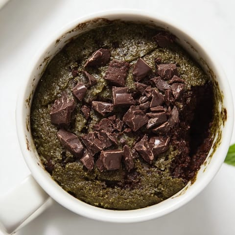 Fudgy, green Matcha Peppermint Brownie Batter Mug Cake, perfect for a fast, delicious treat.