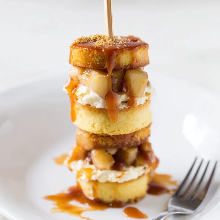 Delightful layers of chai-spiced cake and creamy cheesecake on festive muffin skewers.  