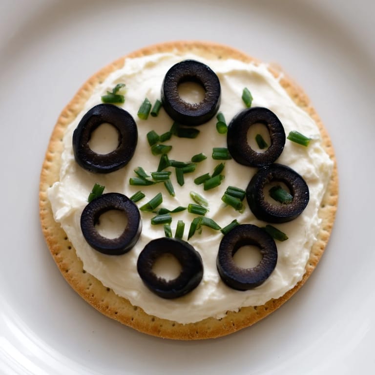 Savory Gold Medal Olympic Ring Appetizers, featuring cream cheese, fresh veggies, and crunchy crackers.