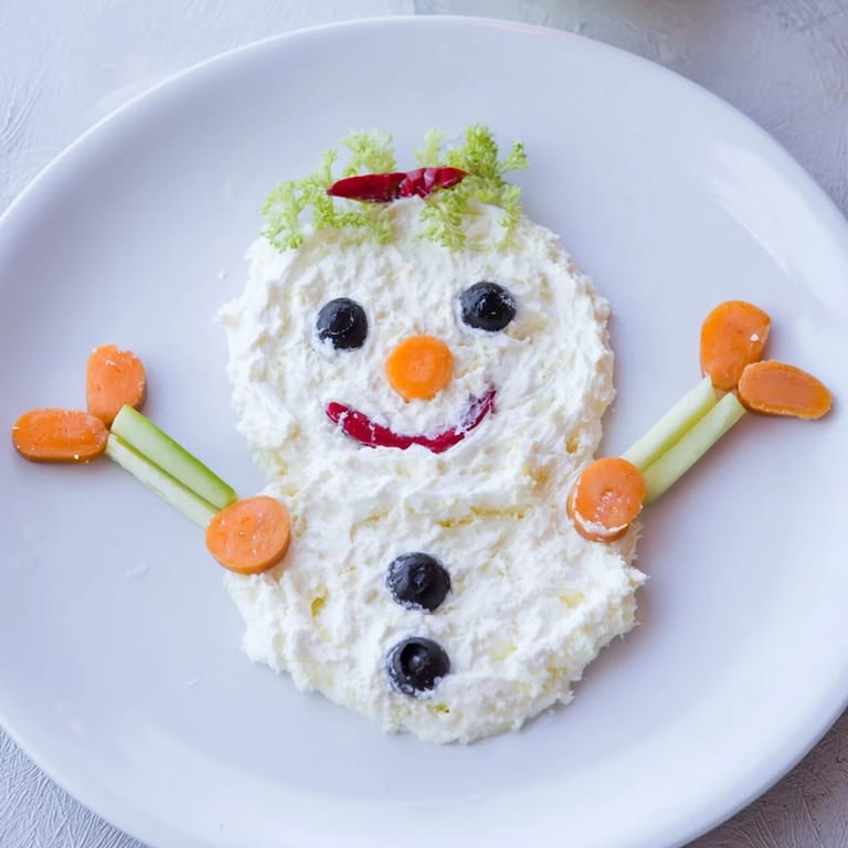 Vibrant Melted Snowman Dip Bowl boasting a creamy base shaped like a melting snowman, ready for dipping!